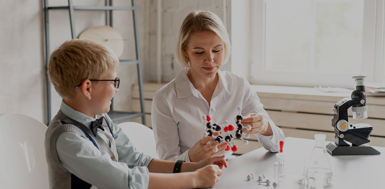 Female science tutor in Passadena studying chemistry with student